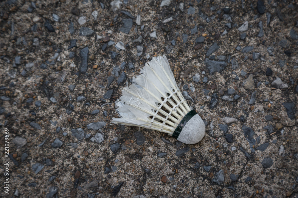 Old damage shuttlecock ,badminton ball on the floor Old damage shuttlecock ,badminton ball on the floor