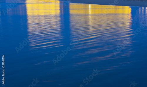 SAN SEBASTIAN, SPAIN - SEPTEMBER 04, 2018: Auditorium reflected in the water of the beach where the San Sebastian film festival is held photo