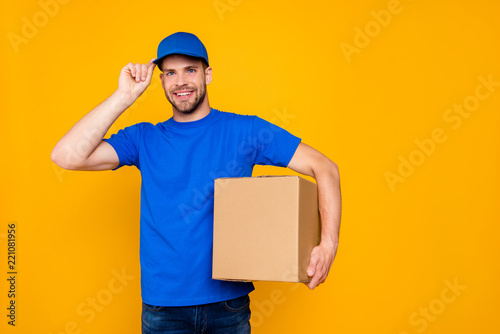 Portrait of handsome attractive cheerful bearded deliver with st