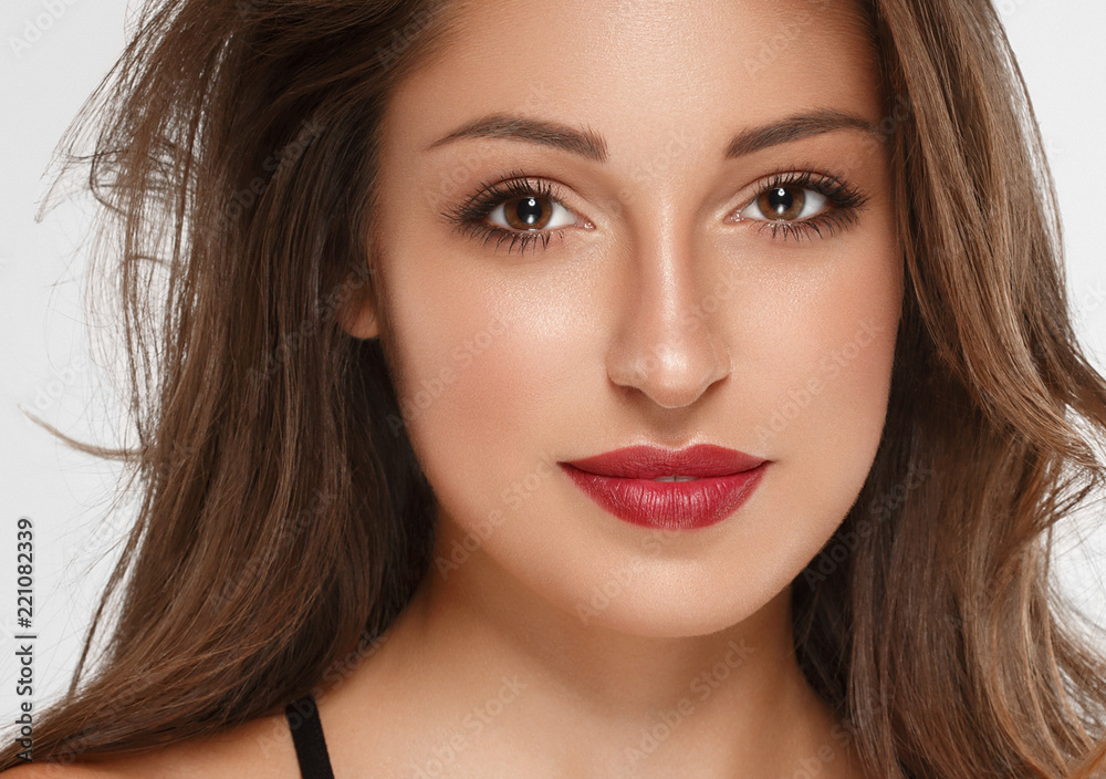 Fototapeta premium Beautiful woman brunette with tanned skin and red lips beauty 