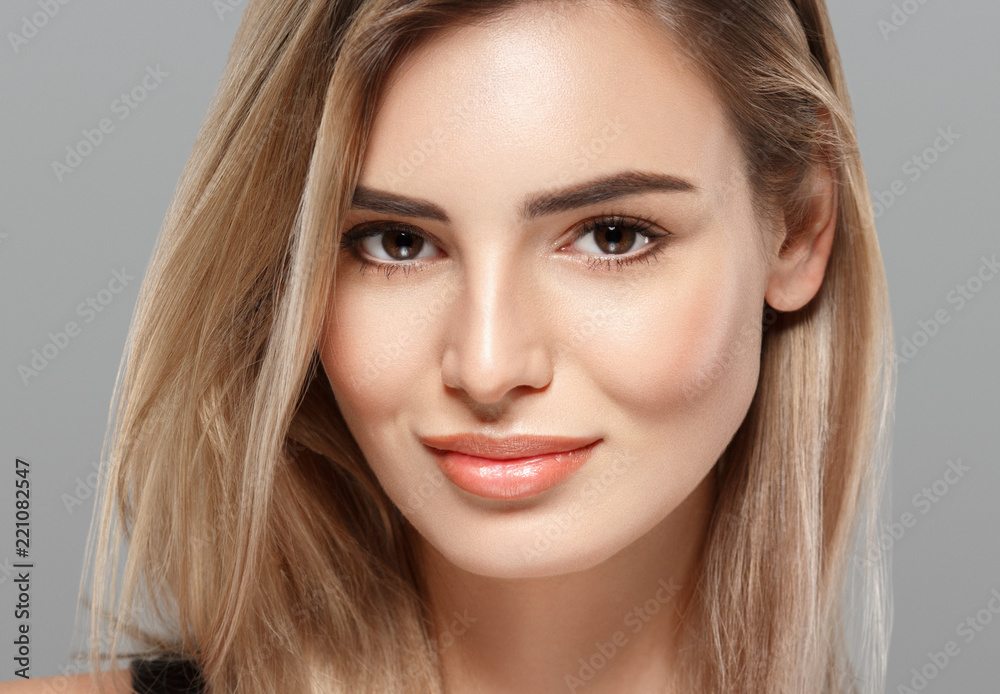 Beautiful blonde woman with curly blonde hair isolated on white with healthy skin and hairstyle female portrait natural makeup Beautiful blonde woman with curly blonde hair isolated on white with healthy skin and hairstyle female portrait natural makeup