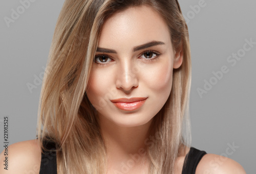 Beautiful blonde woman with curly blonde hair isolated on white with healthy skin and hairstyle female portrait natural makeup