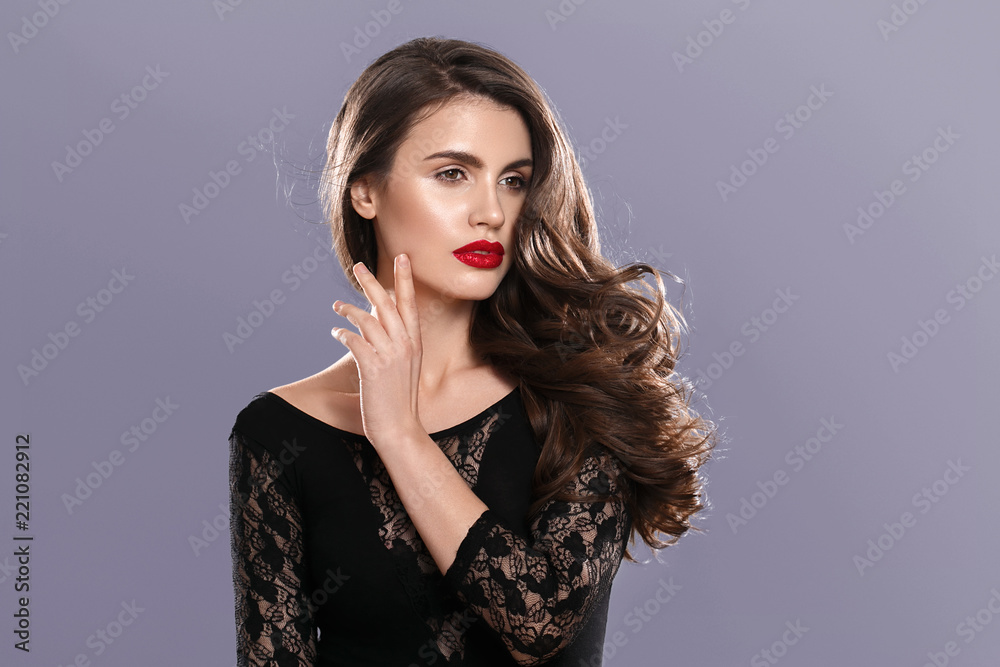Beautiful long curly hair woman with beauty makeup female portrait Beautiful long curly hair woman with beauty makeup female portrait