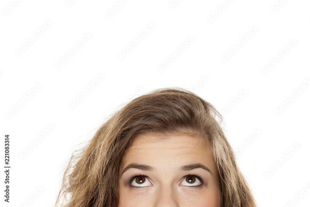 half portrait of a young girl looking up on white background half portrait of a young girl looking up on white background