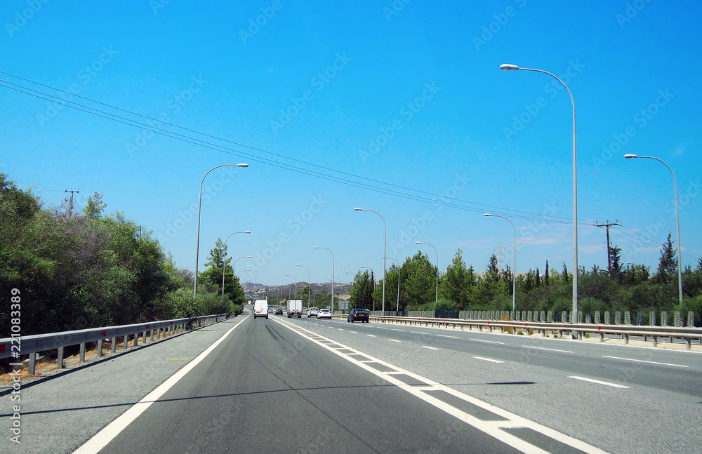 Motorway in Cyprus. Bright sunny summer day with blue clear sky