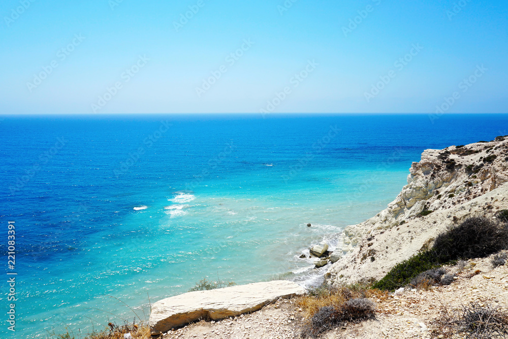 Beautiful seascape with bright blue clear sky and ultramarine sea in sunny summer day not far from the city of Paphos in Cyprus