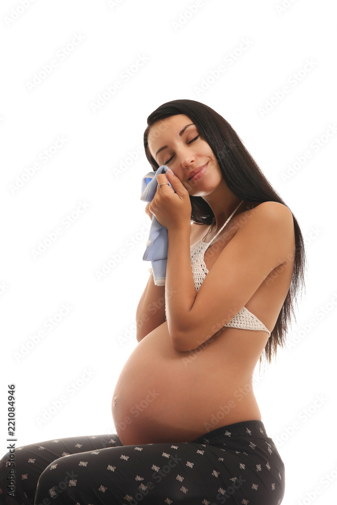 Fototapeta premium Young pregnant woman in studio