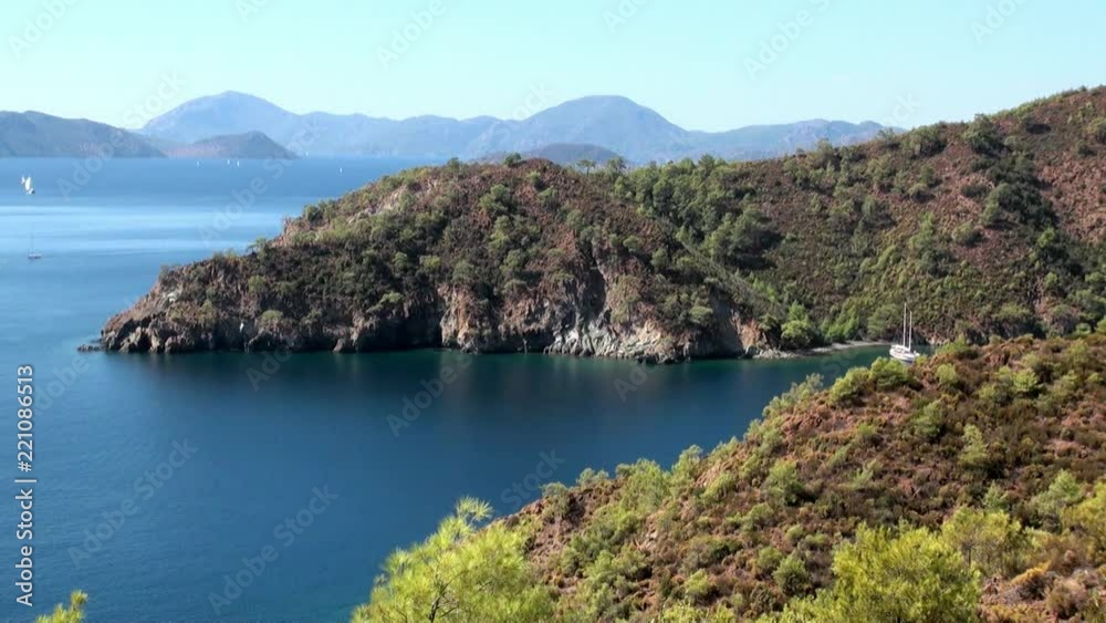 Beautiful seascape and unique coastline landscape with yachts sail in bay. Marine life style. Azure water and horizon of sea. Beautiful seascape and unique coastline landscape with yachts sail in bay. Marine life style. Azure water and horizon of sea.