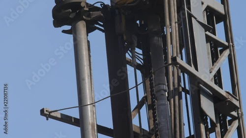 Drilling rig in the coal open pit. Drilling holes for explosives in the quarry. Slow motion, 4k, 60fps. Close up