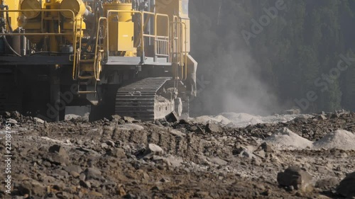 Drilling rig in the coal open pit. Drilling holes for explosives in the quarry. Slow motion, 4k, 60fps