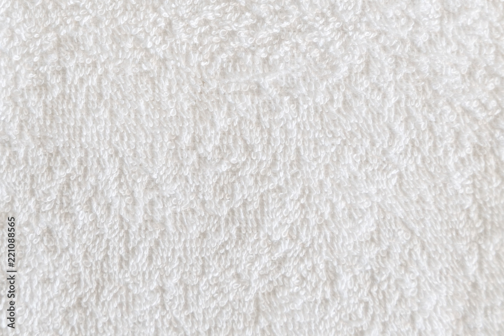 Close up view on white cotton towel. Spa and wellness thing. Selective focus Close up view on white cotton towel. Spa and wellness thing. Selective focus