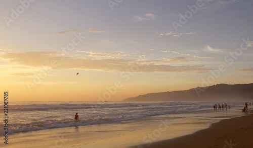 Beautiful sunset on Karon beach. The surf pounds the shore. Phuket, Thailand