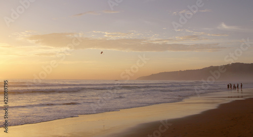 Beautiful sunset on Karon beach. The surf pounds the shore. Phuket, Thailand