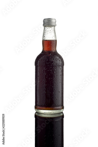 A small coke bottle with water drips and silver bottle cap (ID: 221089939)