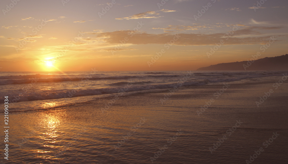 Beautiful sunset on Karon beach. The surf pounds the shore. Phuket, Thailand Beautiful sunset on Karon beach. The surf pounds the shore. Phuket, Thailand