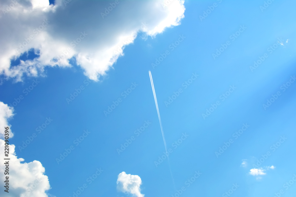 Trace from the plane in the blue sky with clouds Trace from the plane in the blue sky with clouds