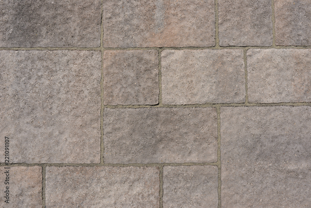 Naklejka premium Mur de pierres reconstituées ton gris rosé