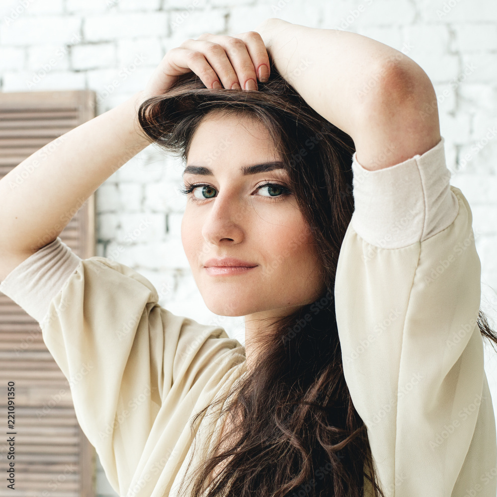 Fototapeta premium Beautiful brunette woman with long hair