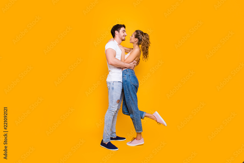 Full body profile portrait of stylish trendy partners enjoying w Full body profile portrait of stylish trendy partners enjoying w