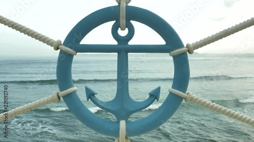 Sailor sign of anchor made of iron at sea beackground