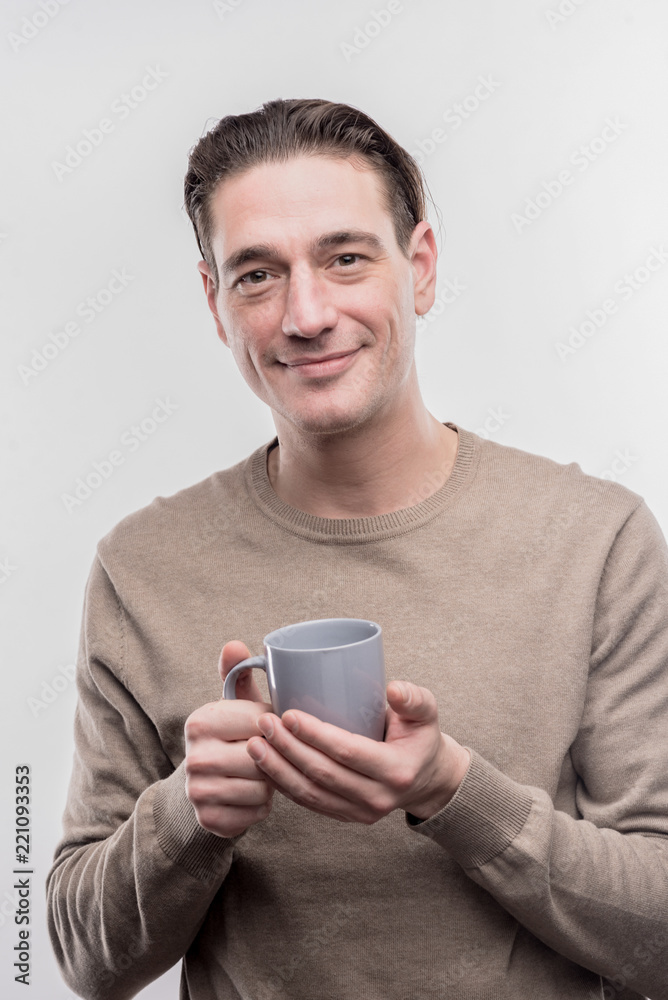 Office worker. Mature office worker holding blue cup with hot tasty coffee on image without face retouching Office worker. Mature office worker holding blue cup with hot tasty coffee on image without face retouching