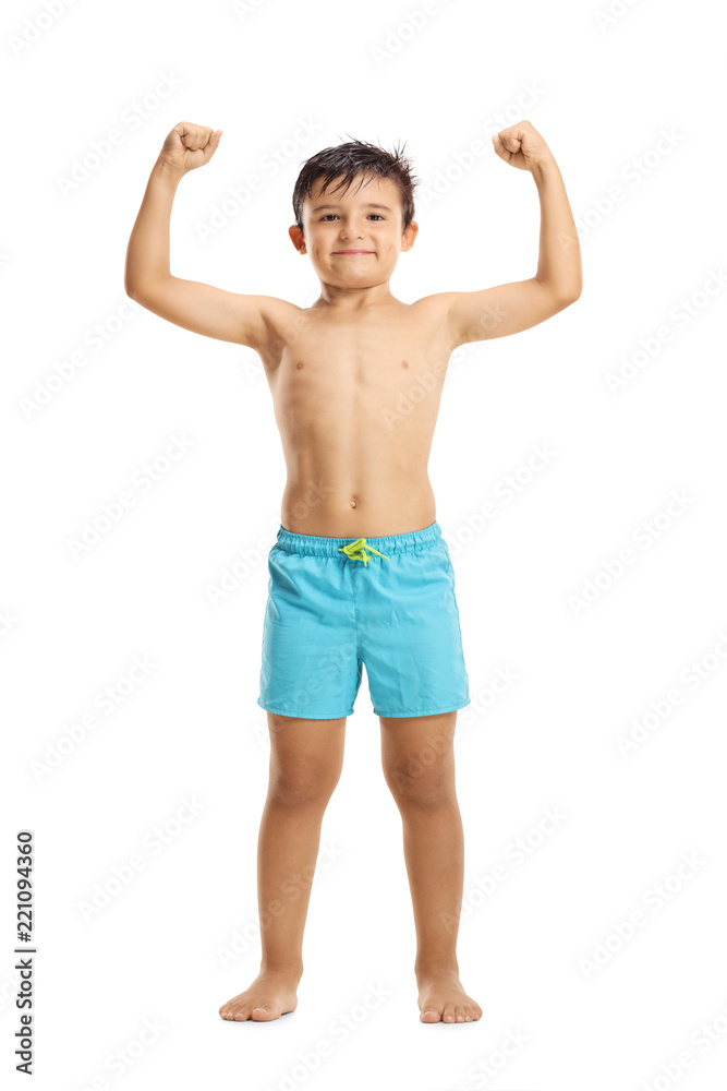 Little boy in swimwear showing muscles
