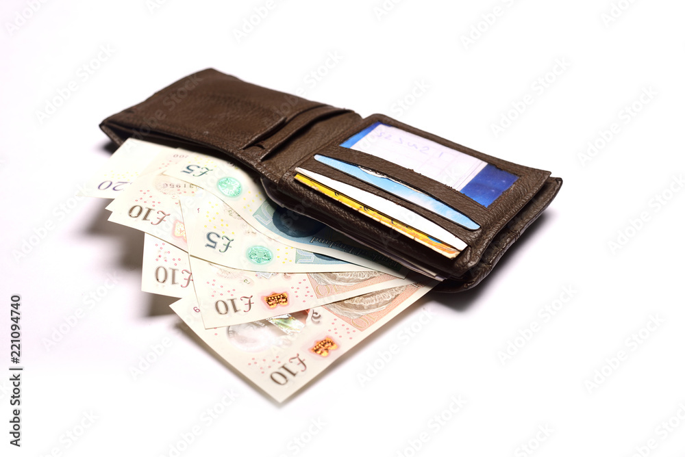Pound sterling in wallet on isolated white background Pound sterling in wallet on isolated white background