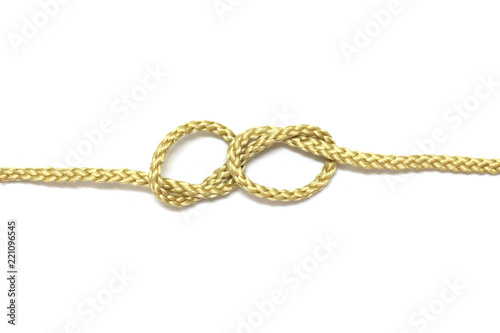 close up of gold rope on white background