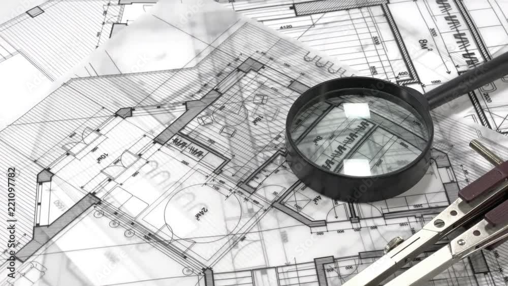 blueprints - architectural drawings and magnifying glass smoothly ...