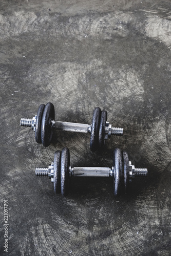 high angle view of adjustable dumbbells on concrete surface