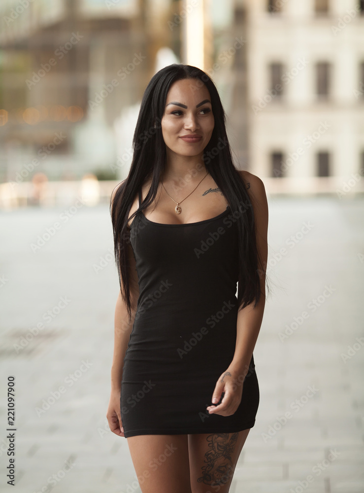 A portrait of a beautiful sexy asian woman smiling brightly at the camera A portrait of a beautiful sexy asian woman smiling brightly at the camera