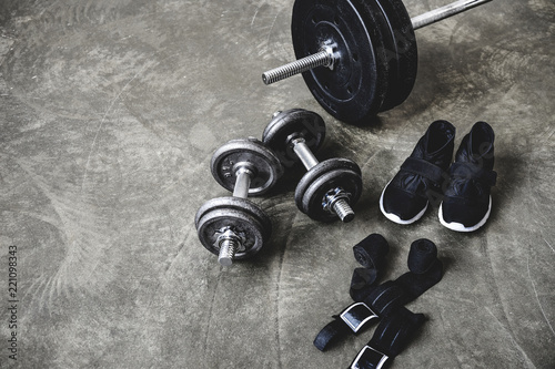 various workout equipment on concrete surface