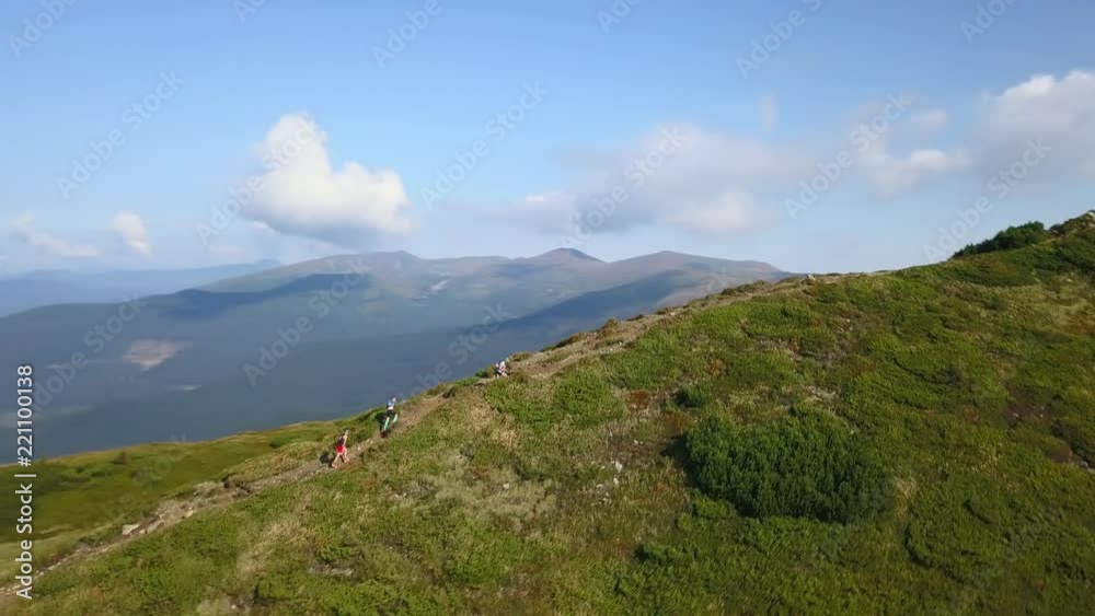 Group of hikers rises in the mountains in the Carpathians drone footage Group of hikers rises in the mountains in the Carpathians drone footage