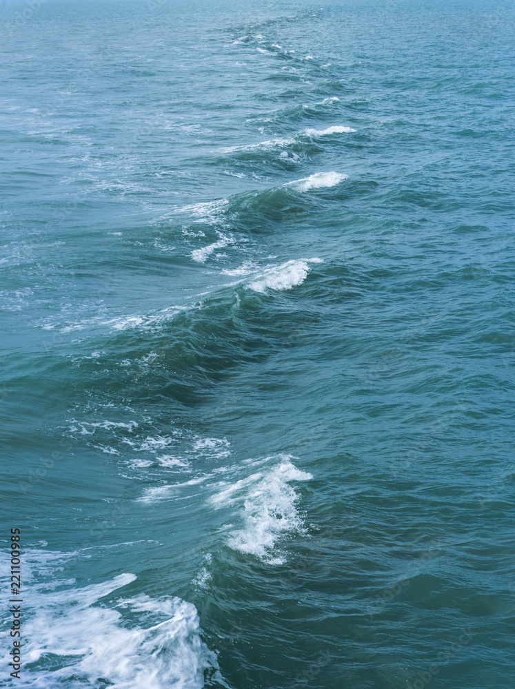 trace tails of speed boat on water surface in the sea