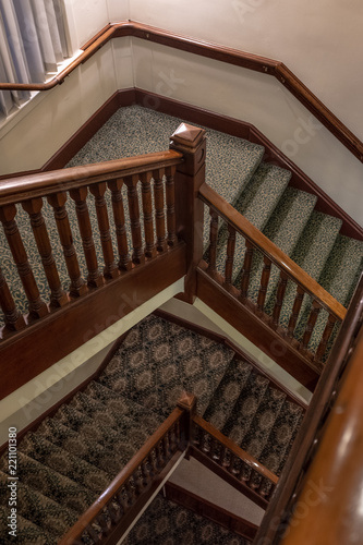 multi level stairs with old fashioned carpet