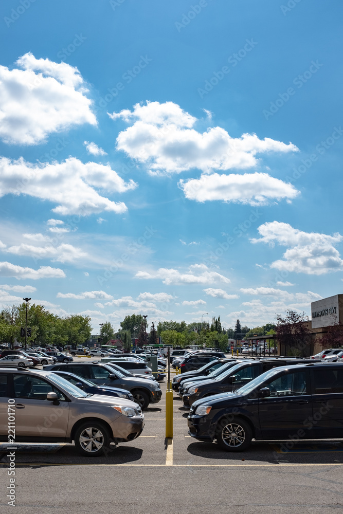 full car park lot under blue summer sky