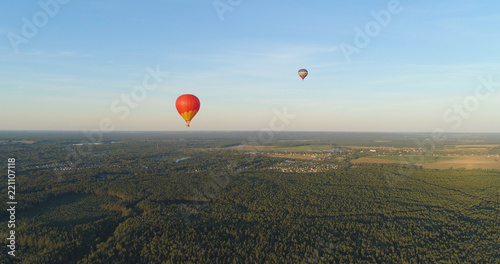 Aerial view Hot air balloons in sky over fields in countryside  beautiful sky and sunset. Aerostat fly over countryside.