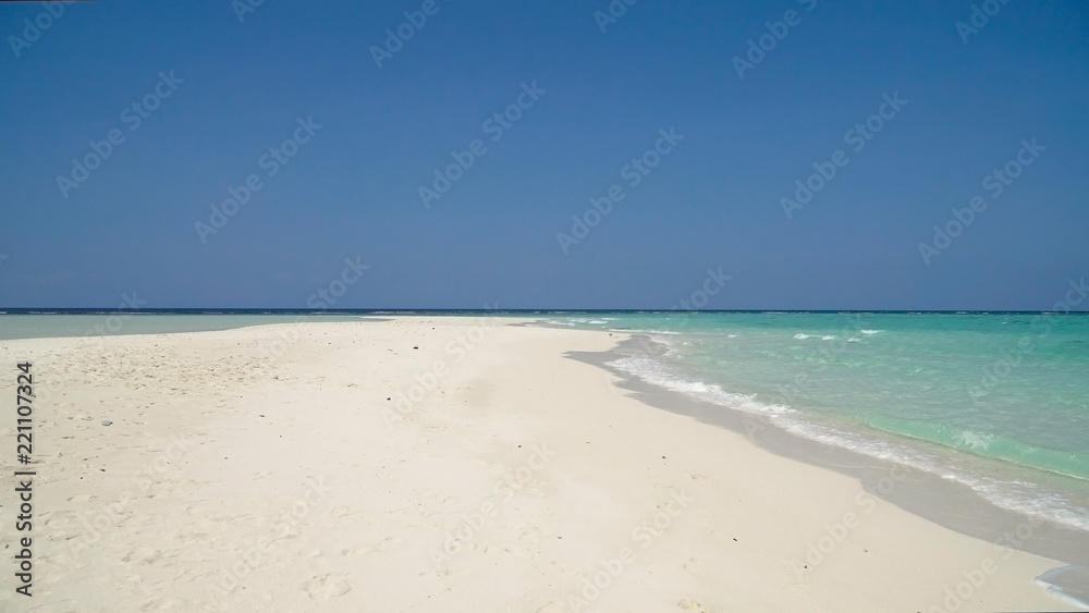 Tropical beach with white sand with beach house on a tropical island. Beautiful sky, sea. Seascape: Ocean and beautiful beach paradise. Philippines. Travel concept.