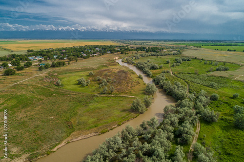 A beautiful view of the forest  fields and river from above. Drone photography of the city