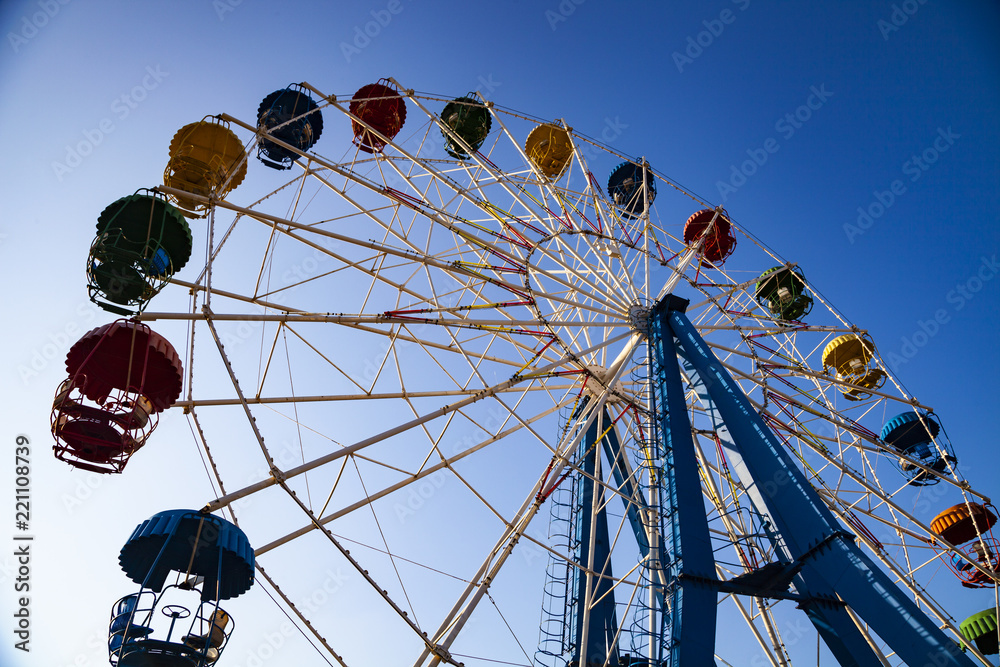 Fototapeta premium Ferris wheel against the blue sky.