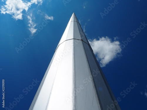 A huge flagpole looking to the sky