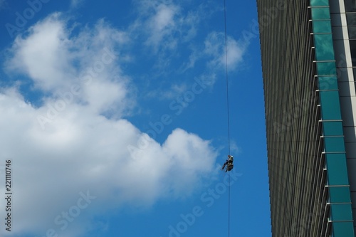 Industrial climber against the blue sky.