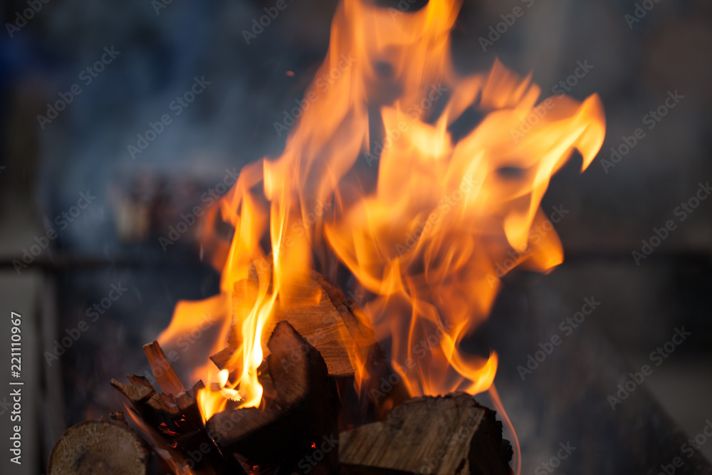 Fire with charcoals. Burning wood. Macro. Live flames with smoke. Wood with flame for barbecue and cooking bbq. Bright color. Fire with charcoals. Burning wood. Macro. Live flames with smoke. Wood with flame for barbecue and cooking bbq. Bright color.
