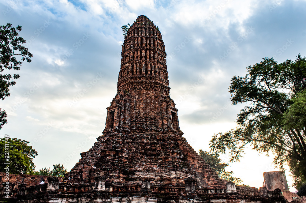 The old tower built of bricks is damaged at Worachet temple in Ayutthaya ,Thailand.