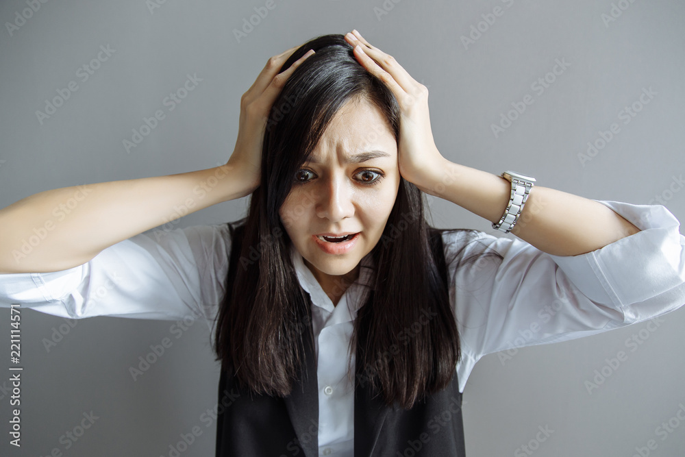 Naklejka premium Stress. Business woman frustrated. Funny image of young Caucasian Asian businesswoman