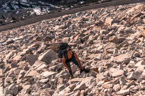 Woman rock climbing, Cardinal Pinnacle, Bishop, California, 
USA photo