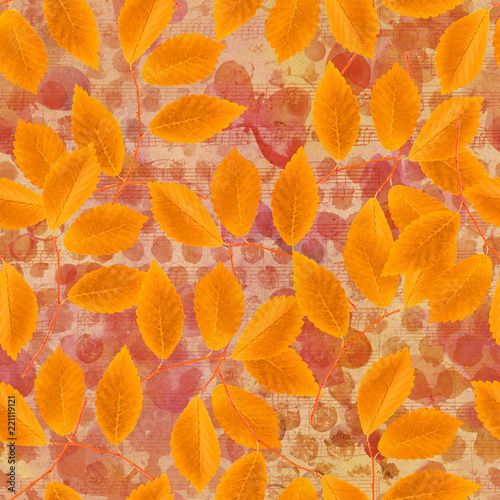 Seamless pattern of yellow autumn leaves on vintage watercolour background with sheet music, a faded fall repeat print
