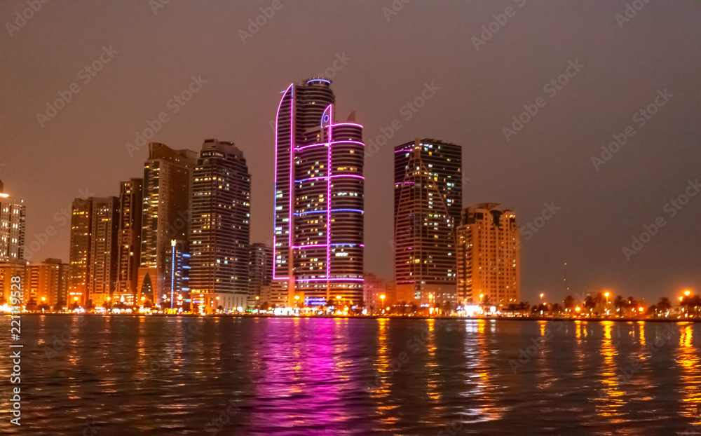 Fototapeta premium A night View of colorful buildings in Dubai Park