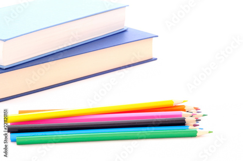 Wallpaper Mural back to school, minimal background, pile of colored pencils and books on the white desk Torontodigital.ca