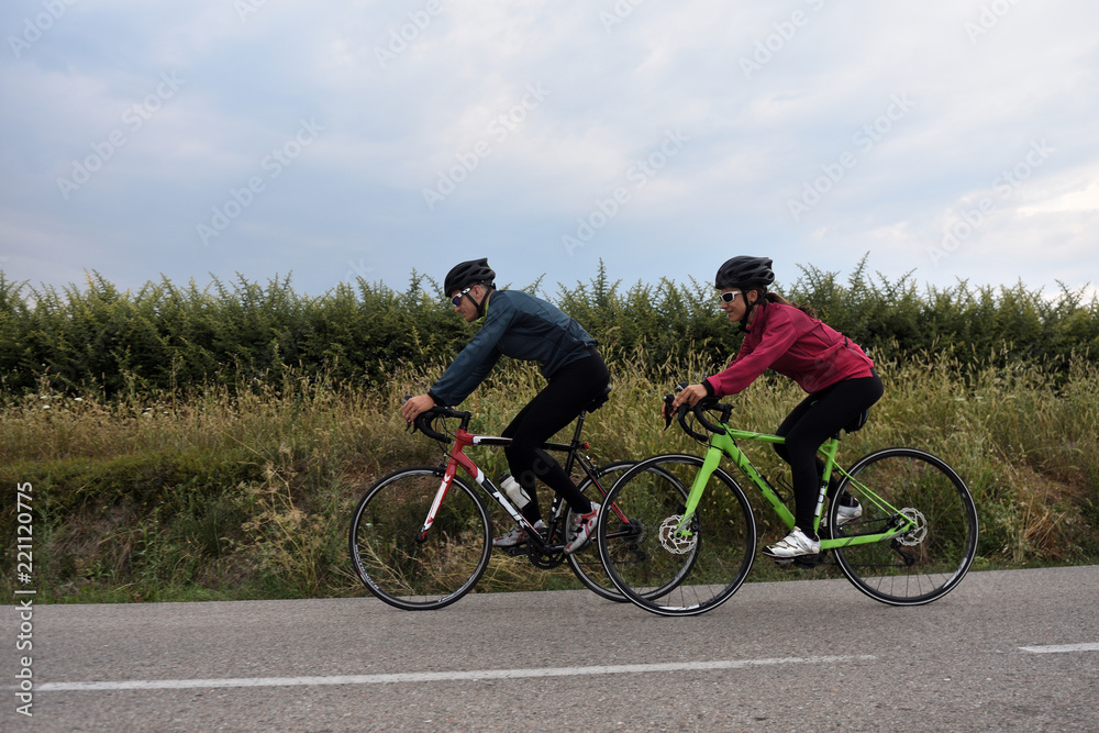 cycling couple on a road